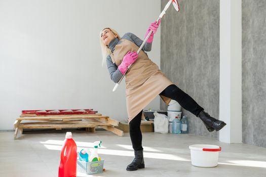 Spring cleaning woman cleaning floor with mop.
