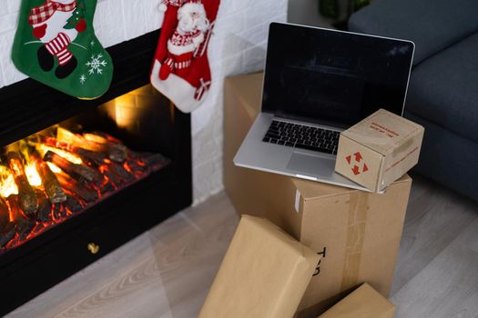 KYIV, UKRAINE - November 16, 2020: boxes Nova Poshta with delivery of Christmas gifts lie near the fireplace