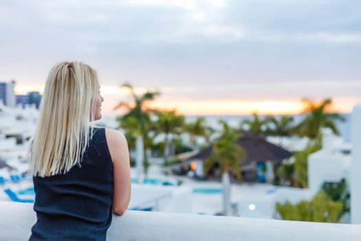 Young attractive woman chilling at the turist resort.