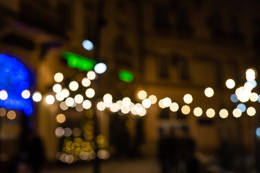 Defocused ligths of blue Christmas tree background.