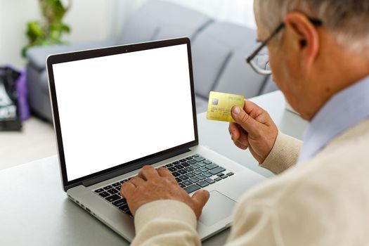 Back view of male person sitting front open laptop computer with blank empty screen for your information or content, modern businessman working in internet