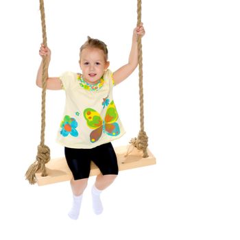 Beautiful little girl swinging on swing. The concept of family happiness, child development, sports education and summer recreation. Isolated on white background.