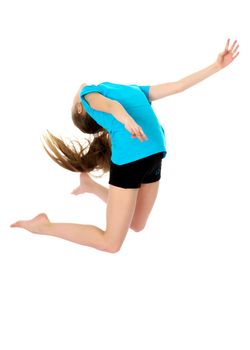 A little girl gymnast joyfully jumps and wags her hands. The concept of sport and fitness. Isolated over white background
