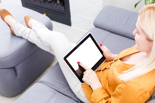Business woman holding blank touch screen device.