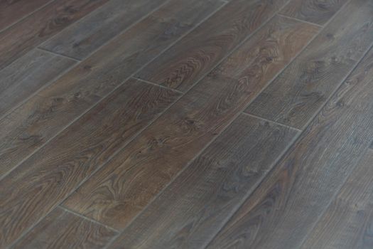 Laminate background. Wooden laminate and parquet boards for the floor in interior design. Texture and pattern of natural wood.