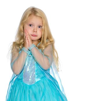 A charming little girl folded her hands around her face. The concept of beauty and fashion, children's emotions. Isolated on white background.