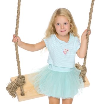 Beautiful little girl swinging on a swing. The concept of family happiness, summer holidays. Isolated on white background.