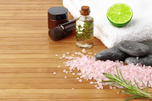 Beauty treatment items for spa procedures on wooden table, close up