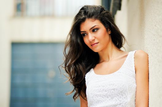 Portrait of a beautiful woman smiling in urban background
