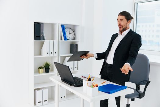 office worker emotions work office desk technology. High quality photo