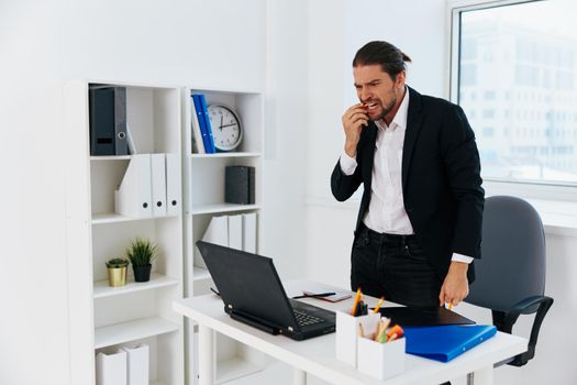 Man workflow in the office documents emotions Lifestyle. High quality photo