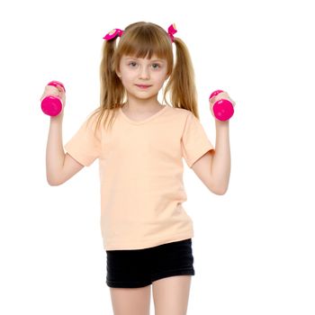 A cute little girl doing exercises with dumbbells. The concept of strength, health and sport. Isolated on white background.