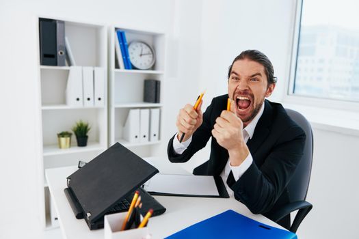 manager emotions work office desk boss. High quality photo
