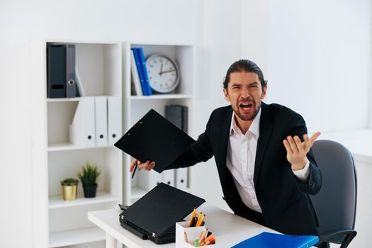 manager emotions work office desk boss. High quality photo