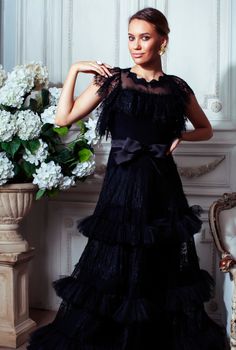 young pretty woman in black lace fashion style dress posing in rich interior of royal hotel room, luxury lifestyle people concept closeup