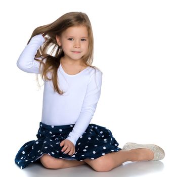 A sweet girl straightens her hair. The concept of fashion and style. Isolated over white background