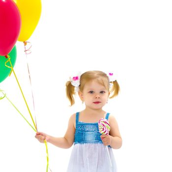 Little girl is playing with a balloon. The concept of the holiday, birthday. Isolated over white background