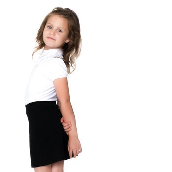 Fashionable little girl in a dress. Beauty and style in children's clothes. Isolated over white background