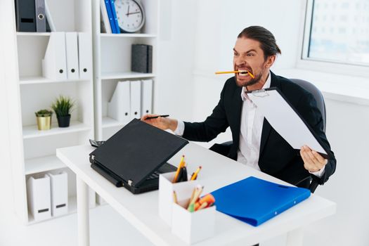Man emotions work office desk boss. High quality photo