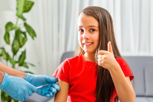 healthcare and medical concept - doctor doing vaccine to child in hospital