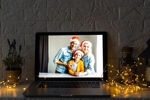 young family video call smiling and looking at webcam web, lovers greet friends merry christmas and happy new year.