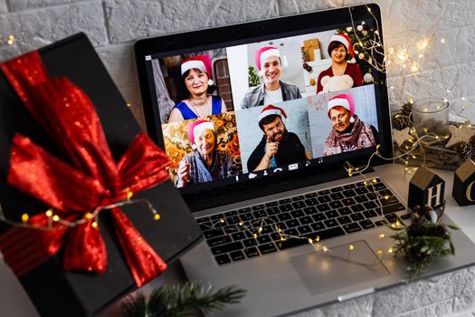 video call celebrating christmas by laptop online during coronavirus outbreak.