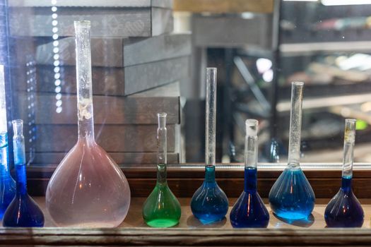 Chemistry laboratory. Conducting a chemical experiment. Experiments in the laboratory. Flasks and test tubes with colored liquid. The child conducts an experiment in a chemical laboratory. The science.