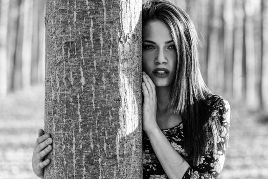 Portrait of pretty girl with green eyes wearing casual clothes in an autumn field