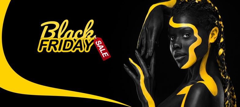 Black friday sale concept. Shopping woman holding grey bag isolated on dark background in holiday