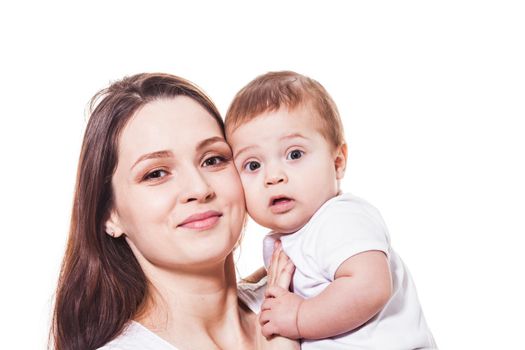 Adorable young mother and child looking at the camera. Portrait on the white backgrund