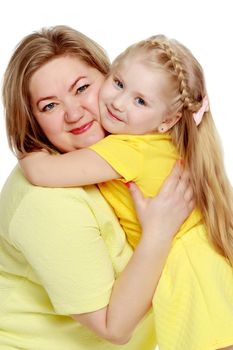 Young blonde mother, gently hugs her favorite little round-faced daughter. Family Idyll.Isolated on white background.