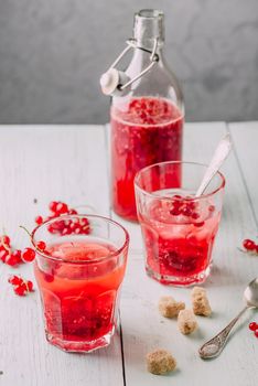 Infused water with fresh red currant and cane sugar