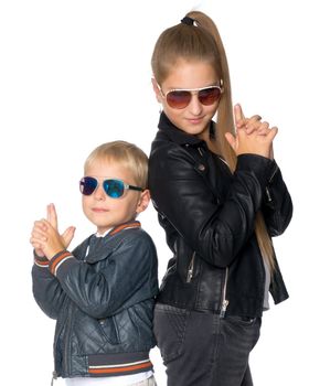 A teenage girl with her younger brother. studio photo session. The concept of family happiness.Isolated on white background.