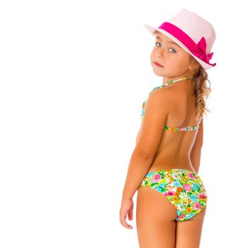 Beautiful little tanned girl in a swimsuit and a hat. The concept of summer family vacations, rest on the sea, beautiful tan. Isolated on white background.