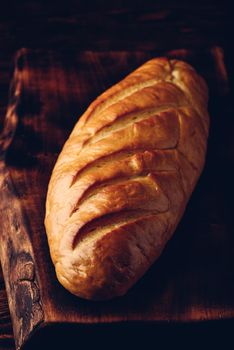 A loaf of bread on a wooden table