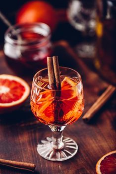 Orange whiskey sour cocktail with bourbon, blood orange juice and simple syrup