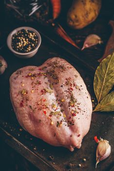 Seasoned chicken breast ready for baking in oven