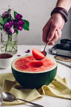 The Spoon with Piece of Watermelon in Man Hand