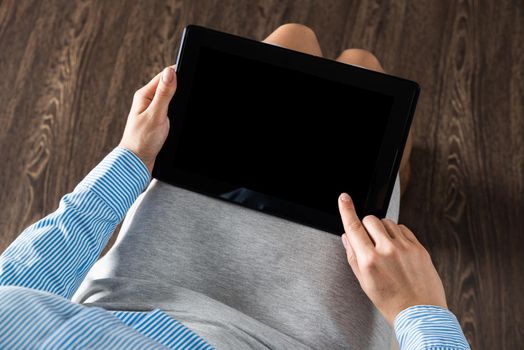 close-up of female hands with a computer tablet