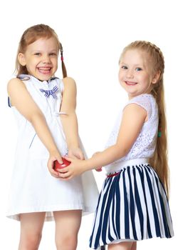 Two cute little girls close-up, in the studio on a white background. The concept of a happy childhood, Beauty and fashion. Isolated.