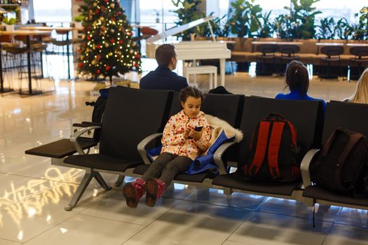 Adorable brunette little girl at airport