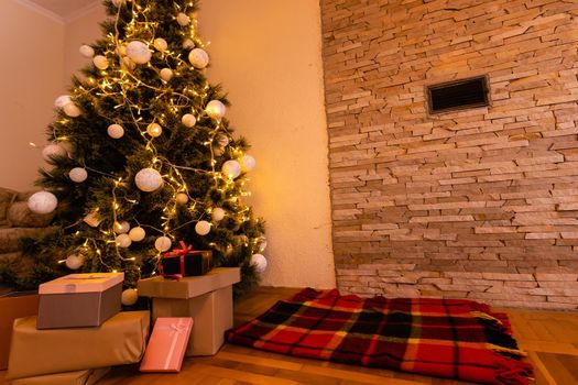 Christmas living room with a Christmas tree, gifts. Beautiful New Year decorated home interior