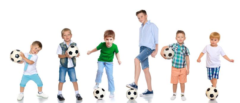 A large group of children and teenagers playing with a soccer ball. The concept of children's sport, a healthy lifestyle. Isolated on white background.