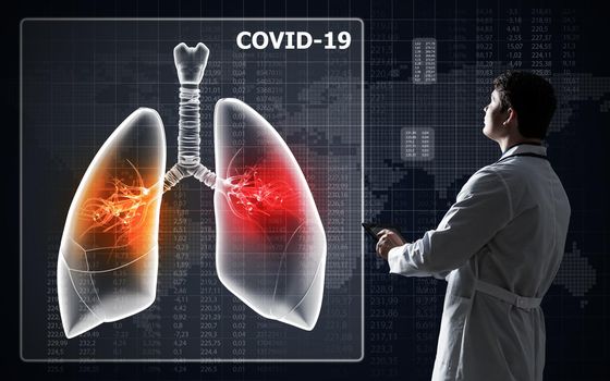Doctor look at lung damage by COVID virus infection. Digital health concept