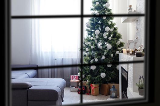 wiew through the window, Christmas Tree on background, winter holiday concept