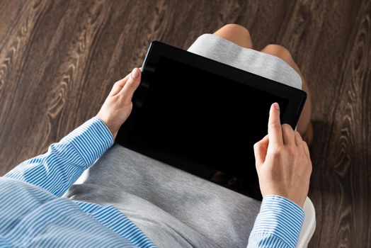 close-up of female hands with a computer tablet