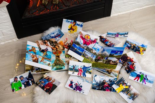 photo books lie near the fireplace at christmas