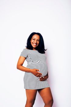 young pretty african american woman pregnant happy smiling, posing on white background isolated , lifestyle people concept copyspace close up