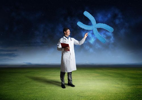 Doctor touches chromosome symbol, virtual technology in medicine