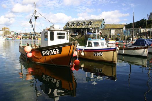 Fishing boats in the harbour of Mevagissey Port Cornwall